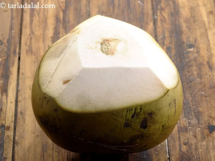 Step 13 – This is how the coconut looks like after the entire hard shell has been cut …