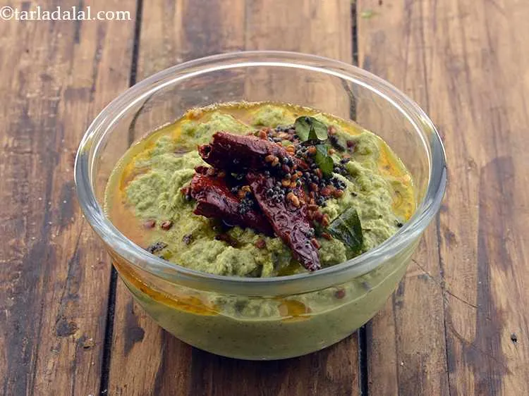 Step 14 – Mix well and pour this tempering over the <strong>coconut chutney</strong>.