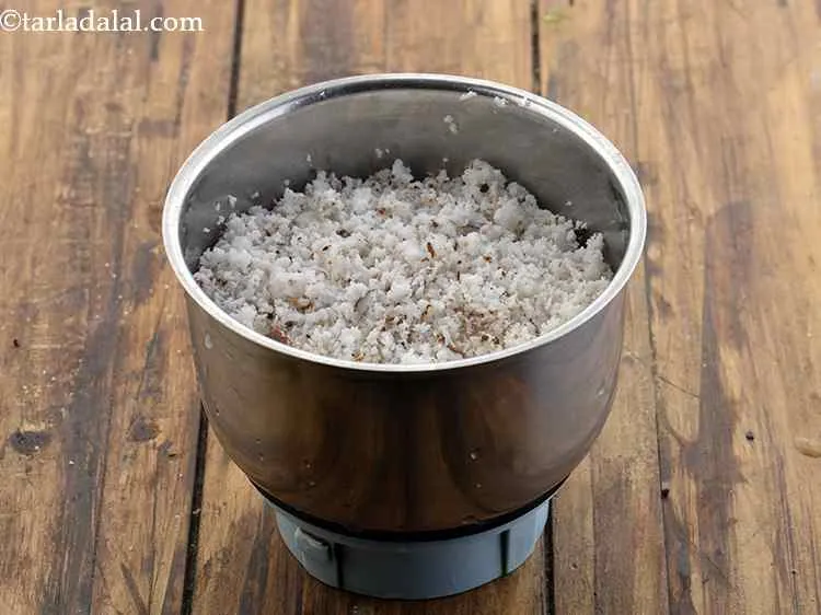 Step 1 – In a mixer jar, add the grated coconut. You can use fresh or frozen coconut. …