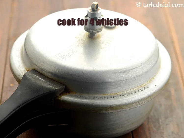 Step 9 – Close the lid of the pressure cooker and allow them to cook for 4 whistles.<br …