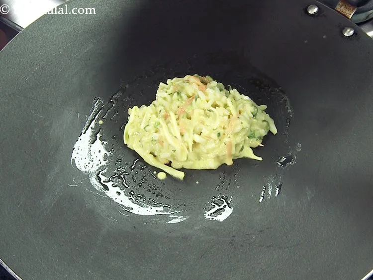 Step 14 – Pour a ladleful of the batter on it.