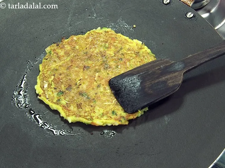 Step 17 – Flip it carefully and cook till it turns golden brown in colour from both the …