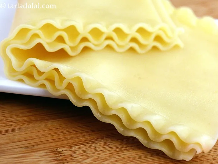 Step 58 – Place two sheets of lasagna in the baking dish.