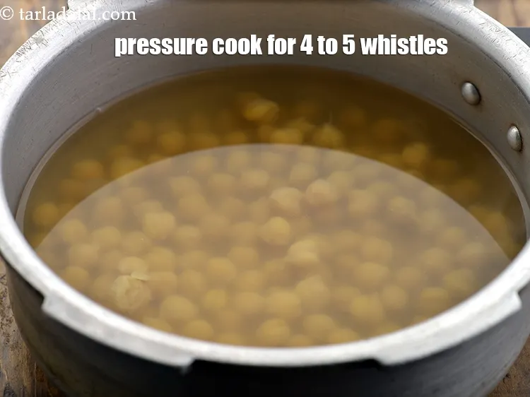 Step 11 – <meta charset="UTF-8" />Pressure cook it for 4&nbsp;to 5&nbsp;whistles over a medium flame or until they …