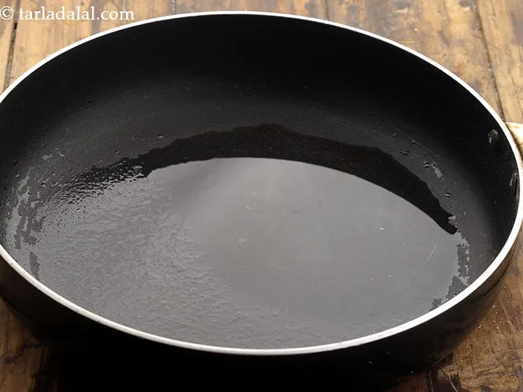 Step 10 – Heat oil in a broad non stick pan.