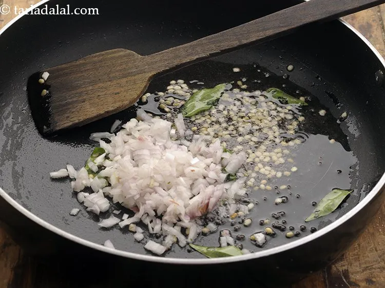 Step 15 – Add onions and saute on a medium flame for 1 minute.&nbsp;