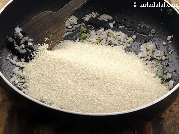 Step 16 – Add roasted semolina and salt to taste. And saute for a minute on medium flame.