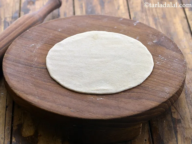 Step 18 – Take a portion of the dough and roll into a 150 mm. (6") diameter circle …