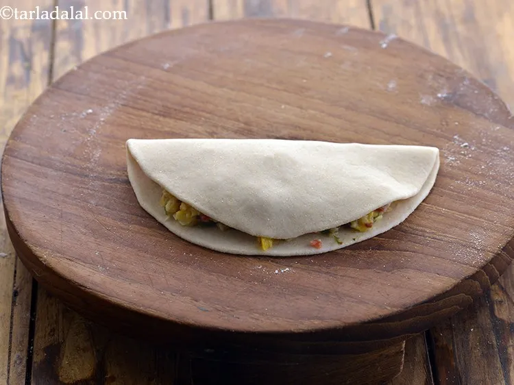 Step 20 – Fold over the other half of the circle over the stuffing to make a semi-circle.