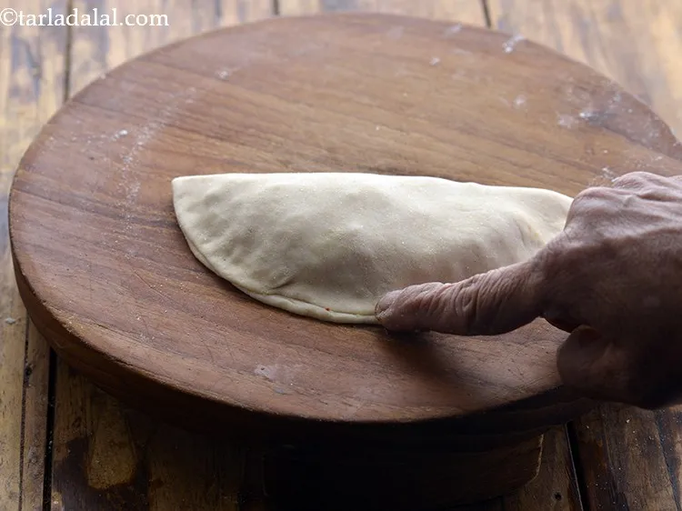 Step 21 – Press it lightly to seal the edges.