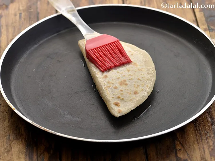Step 23 – Brush a little oil over the quesadilla and turn over to cook.