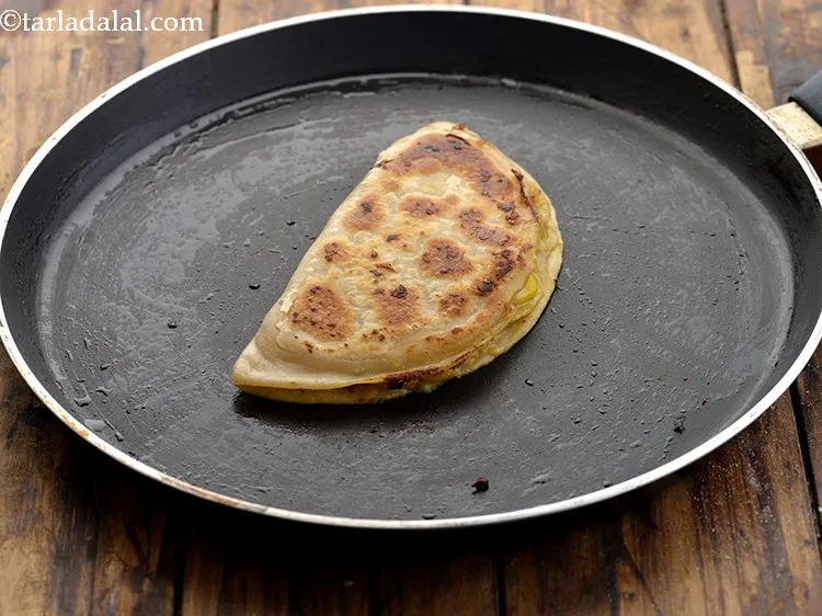 Step 24 – Again brush &frac12; tsp of oil and cook till golden and crisp from both the …