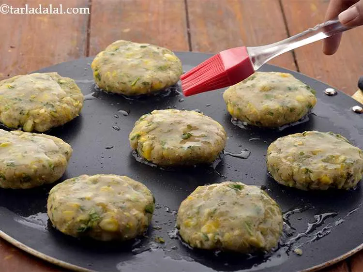 Step 31 – Cook the&nbsp;corn potato cutlets&nbsp;on a medium flame.