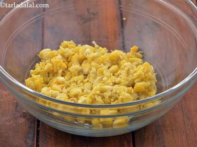 Step 12 – In a deep bowl, transfer the coarsely crushed sweet corn kernels.