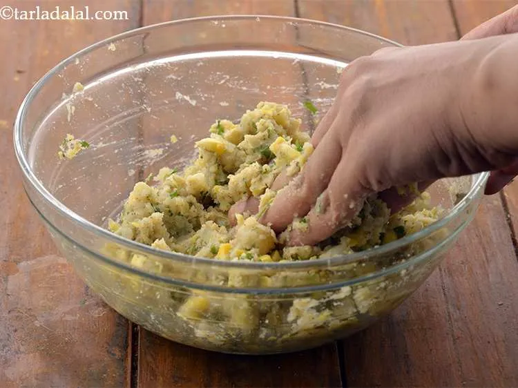Step 18 – Mix well and our <strong>Corn and Potato tikkis</strong> mixture is ready.