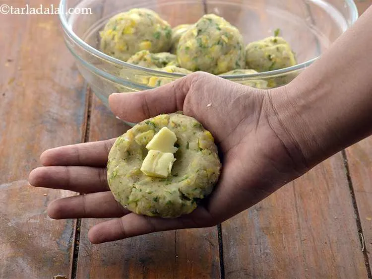 Step 21 – Place 2 cheese cubes in the depression. We have made use of processed cheese but, …