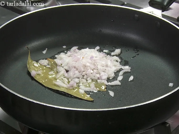 Step 27 – Add 1/4 cup&nbsp;finely&nbsp;<a href="https://www.tarladalal.com/glossary-chopped-onions-722i">chopped onions</a>.