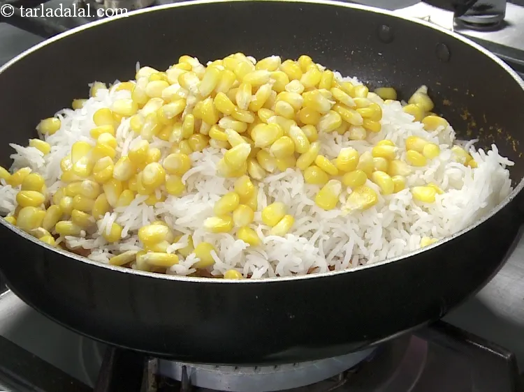 Step 32 – Add 3/4 cup&nbsp;<a href="https://www.tarladalal.com/glossary-boiled-sweet-corn-kernels-153i">cooked corn</a>.