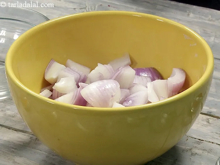 Step 14 – For the paste, add 1 cup&nbsp;roughly&nbsp;<a href="https://www.tarladalal.com/glossary-chopped-onions-722i">chopped onions</a> in a mixer jar.