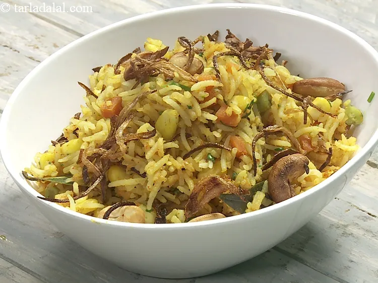 Step 39 – Garnish with 1/4 cup&nbsp;<a href="https://www.tarladalal.com/glossary-fried-onions-924i">deep-fried onions</a>.