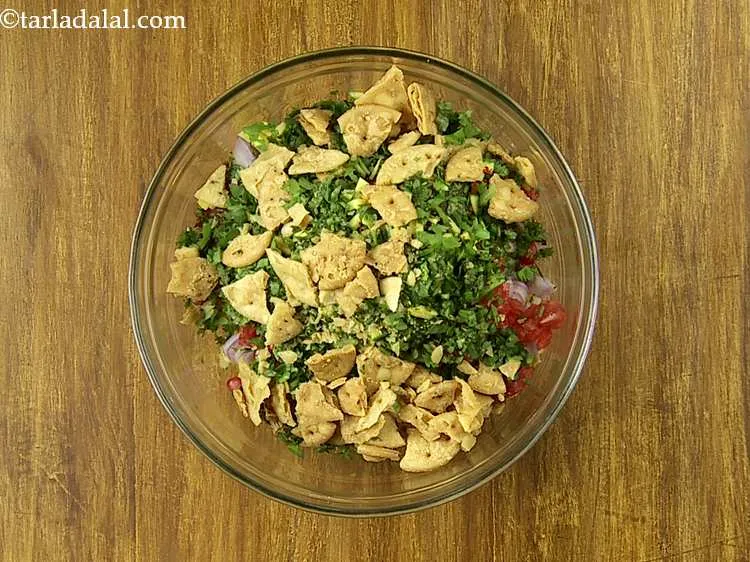 Step 15 – Finally, add crushed Papadis. Our website has recipe for both fried and baked papdi. Make …