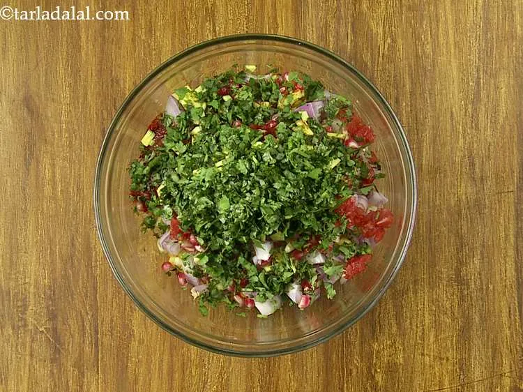Step 14 – Add the chopped raw mango and coriander.