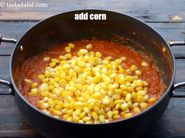 Step 23 – Add 1 1/2 cups&nbsp;<a href="https://www.tarladalal.com/glossary-boiled-sweet-corn-kernels-153i">boiled sweet corn kernels (makai ke dane)</a>.<br /> &nbsp;