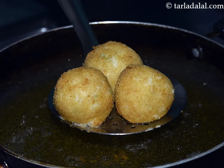 Step 19 – Deep-fry the&nbsp;<strong>Corn Cheese Balls</strong>&nbsp;on a medium flame till they are golden brown in colour from …