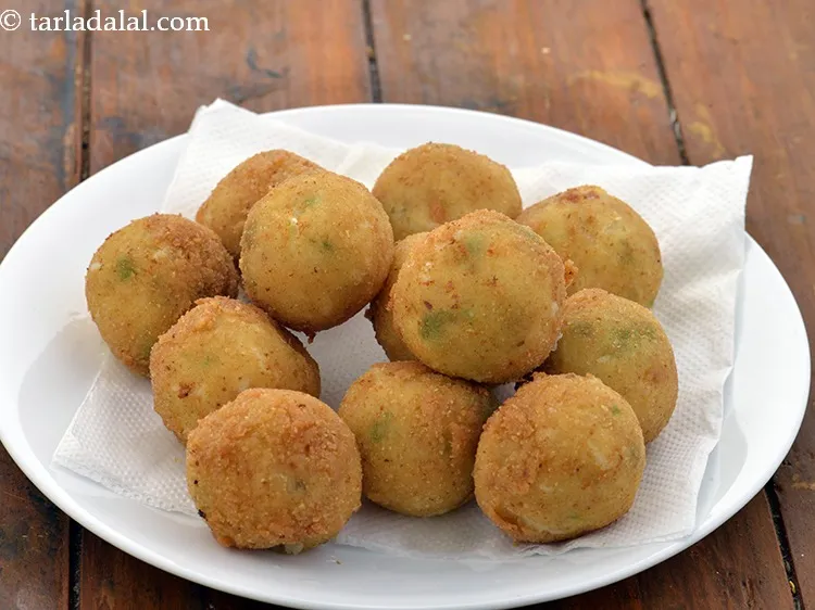 Step 20 – Drain<strong>&nbsp;Cheese Corn Balls&nbsp;</strong>on absorbent paper.