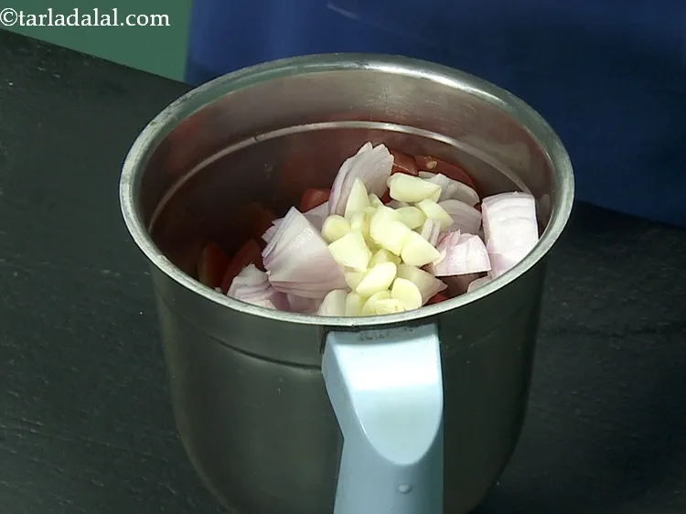 Step 25 – Add onions and garlic.