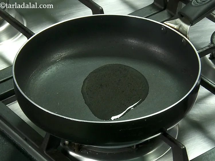 Step 27 – Heat the oil in a broad non-stick pan.