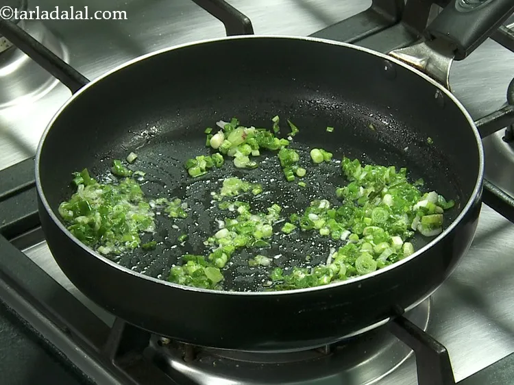 Step 29 – Also, add the greens and saut&eacute; on a medium flame for 30 seconds.