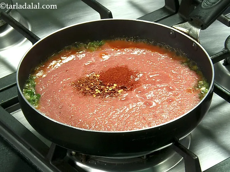 Step 31 – Add red chilli flakes and chilli powder.