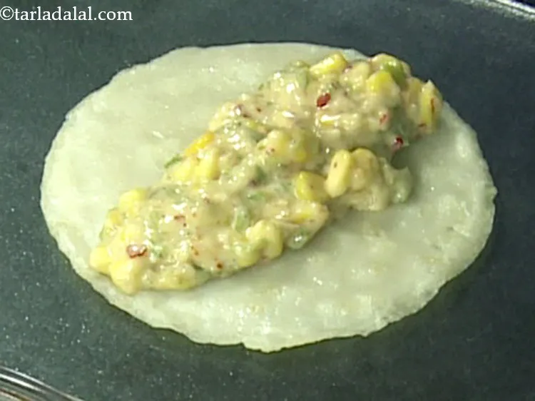 Step 36 – Put a portion of the corn stuffing in the centre.