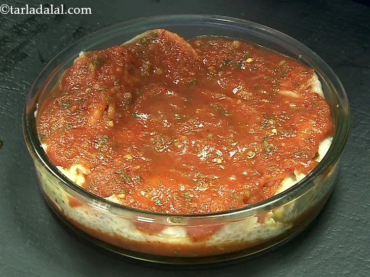 Step 42 – Pour all the remaining tomato sauce evenly over it.
