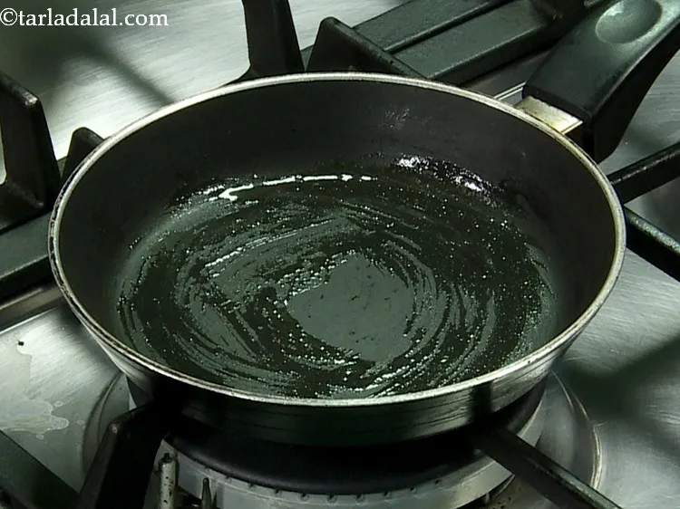 Step 5 – Grease a 125 mm. (5") diameter non-stick pan with melted butter.