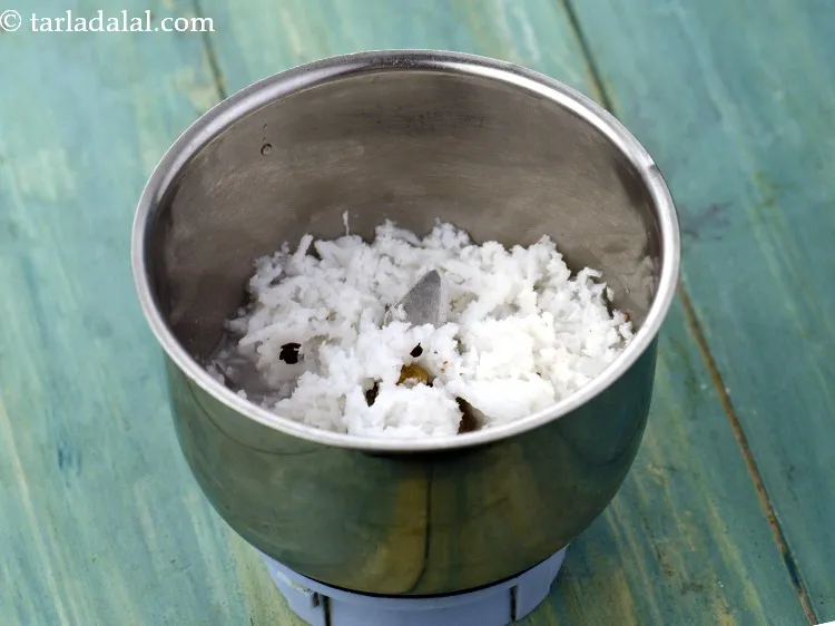 Step 5 – To make paste, add 4 tbsp&nbsp;freshly&nbsp;<a href="https://www.tarladalal.com/glossary-grated-coconut-852i">grated coconut</a>&nbsp;in a mixer jar.&nbsp;