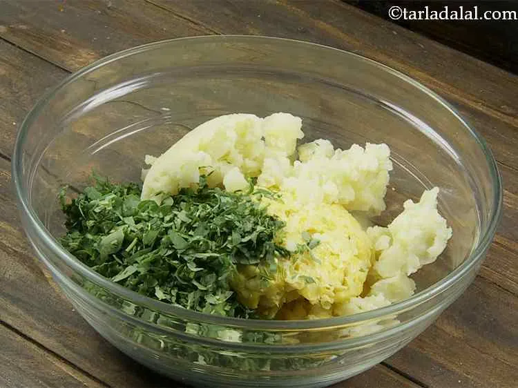 Step 3 – Now add the potatoes. The potatoes are first boiled and then mashed thoroughly with the …