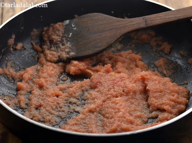 Step 15 – Add the tomato pulp and saut&eacute; on a medium flame for few seconds.
