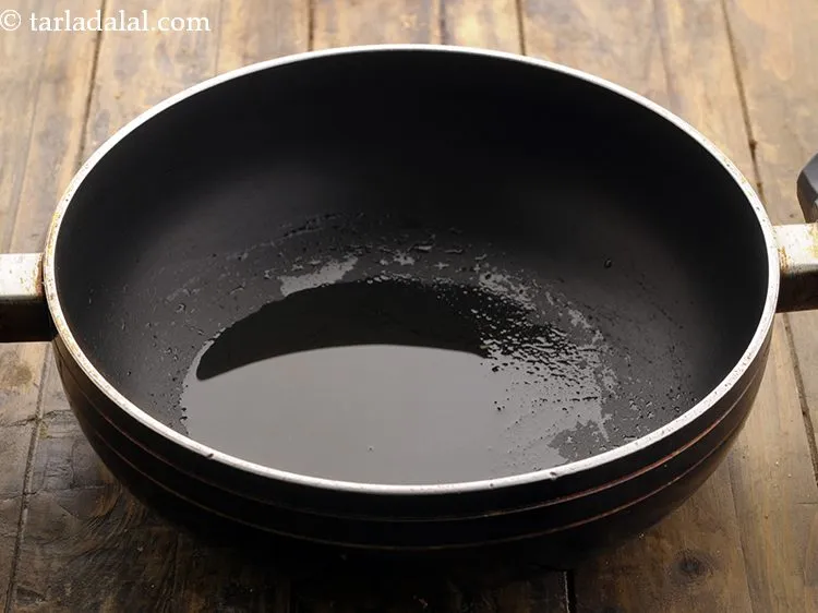 Step 2 – To make <strong>corn poha</strong>, heat the oil in a deep non-stick pan and add the …