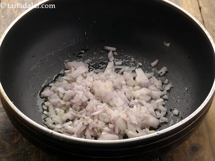 Step 4 – When the seeds crackle, add onions.&nbsp;