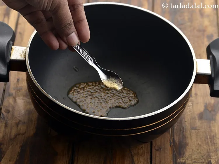 Step 12 – Then add a pinch of asafoetida.&nbsp;