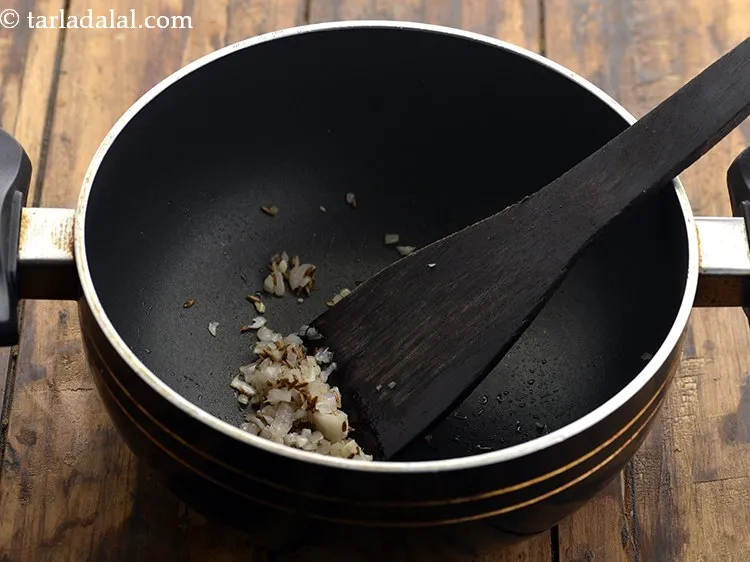 Step 14 – Saut&eacute; the onions on a medium flame for 30 seconds.&nbsp;