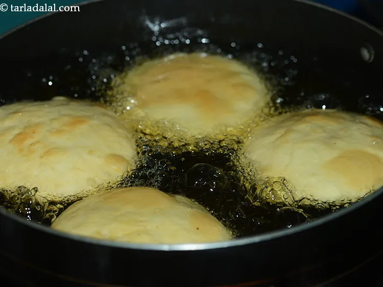 Step 40 – This corn kachori is fried on a medium flame for 4 minutes, followed by frying …