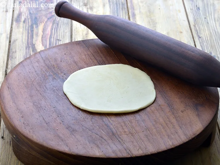 Step 30 – Roll a portion of the dough into a 100 mm. (4 ") diameter circle.