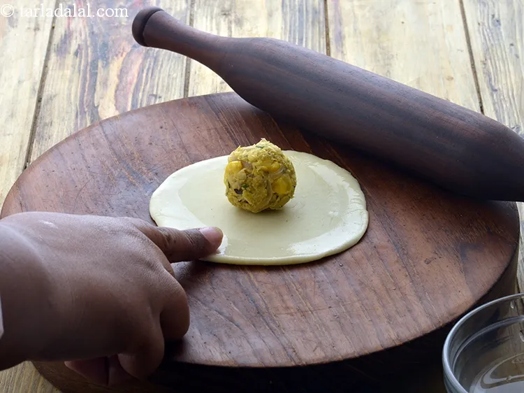 Step 31 – Place a portion of the corn filling in the centre.