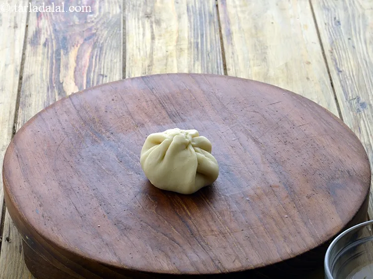 Step 32 – Bring together all the sides in the centre.