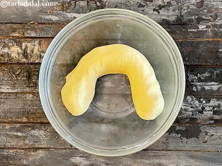 Step 11 – Make the dough into a cylinderical shape. That makes it easier to make 15 round …