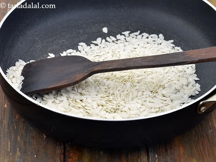 Step 29 – Keep a close watch while roasting the poha as they tend to burn easily. Keep …