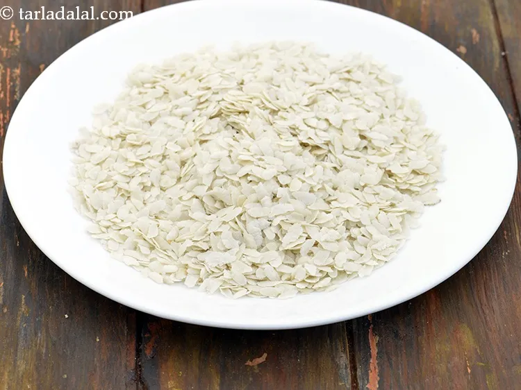 Step 8 – Transfer the beaten rice onto a plate. This is to arrest further cooking. Keep aside.